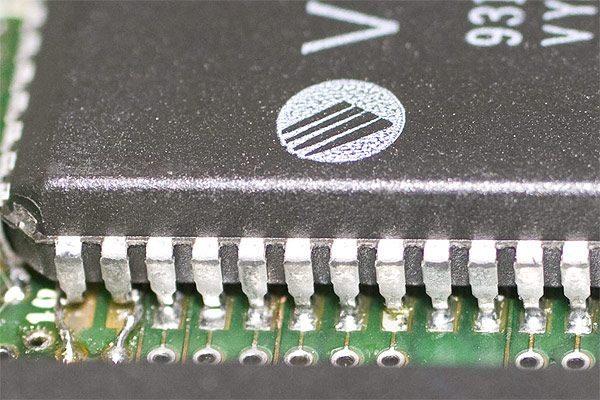 A new MEMC chip soldered into place showing how the pad repairs work