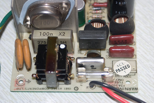 The newly fitted X2 capacitors on the power supply circuit board